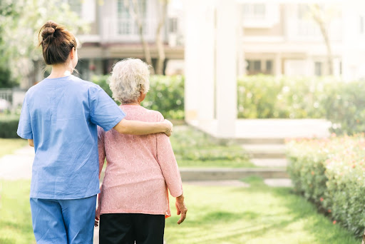 Carer and resident walking